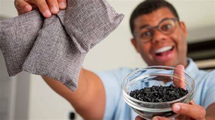 Does activated charcoal adsorb water?